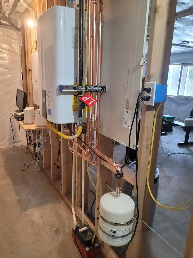 Licensed plumber repairing a kitchen sink in Ulysses