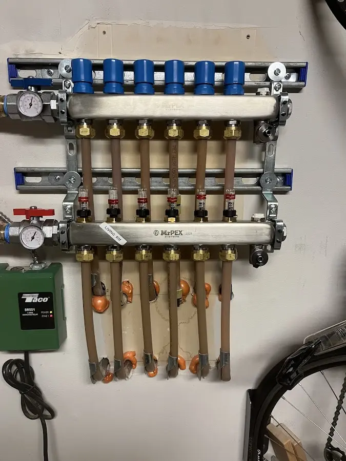 Plumber performing Water Heater Repair at a residential property in Ulysses